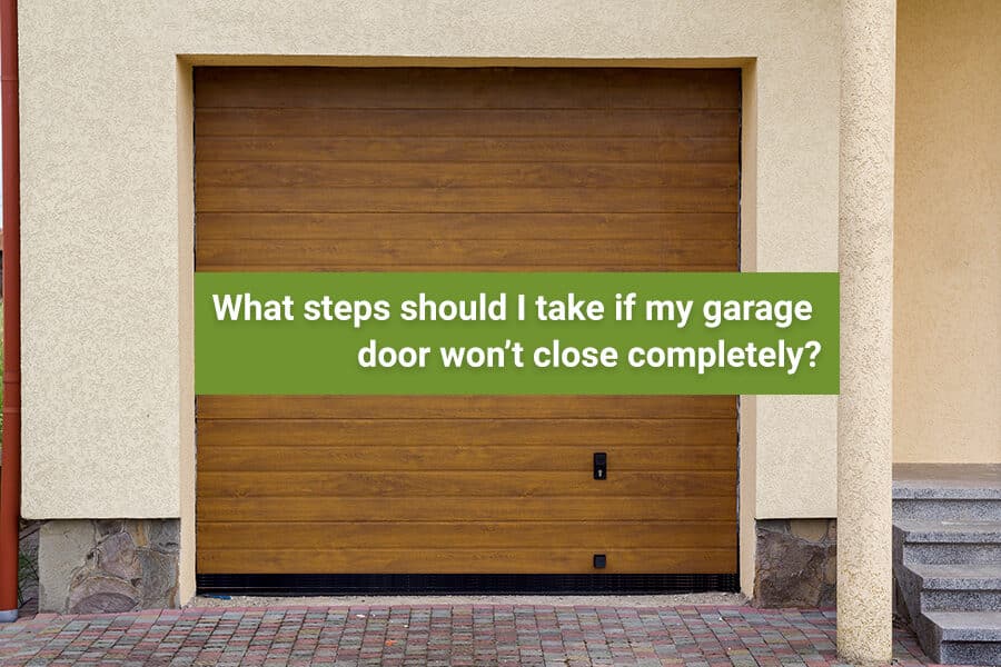 What steps should I take if my garage door won’t close completely