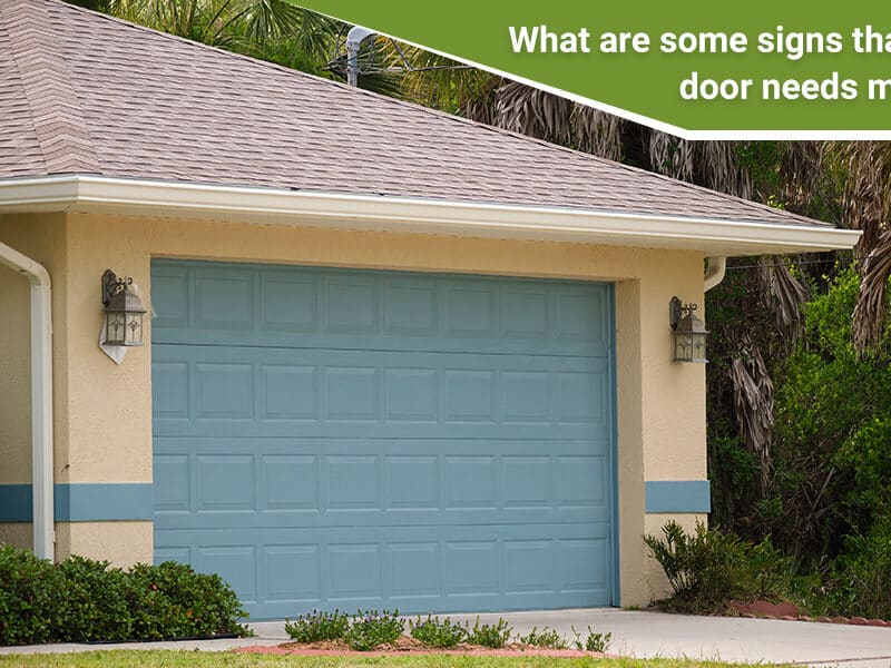 What are some signs that my garage door needs maintenance