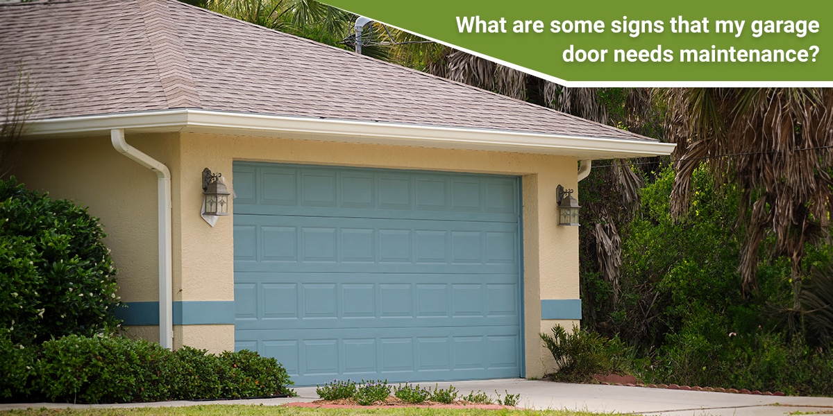 What are some signs that my garage door needs maintenance