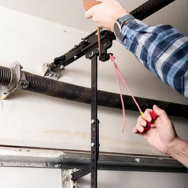 Close-up of garage door spring and cable components