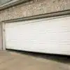 Garage door off track and sitting crooked on a residential home in Ottawa